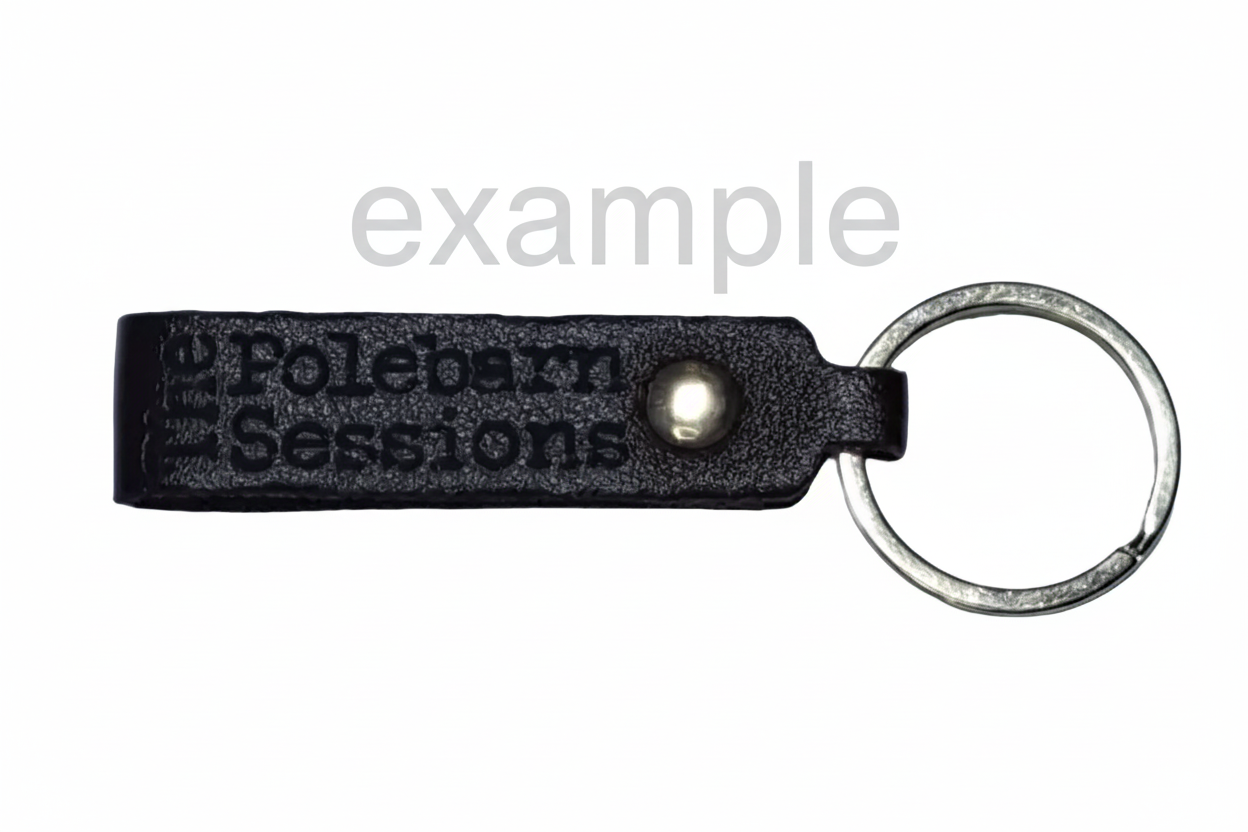 Black leather keychain with 'The Polebarn Sessions' branding, pictured on a white background