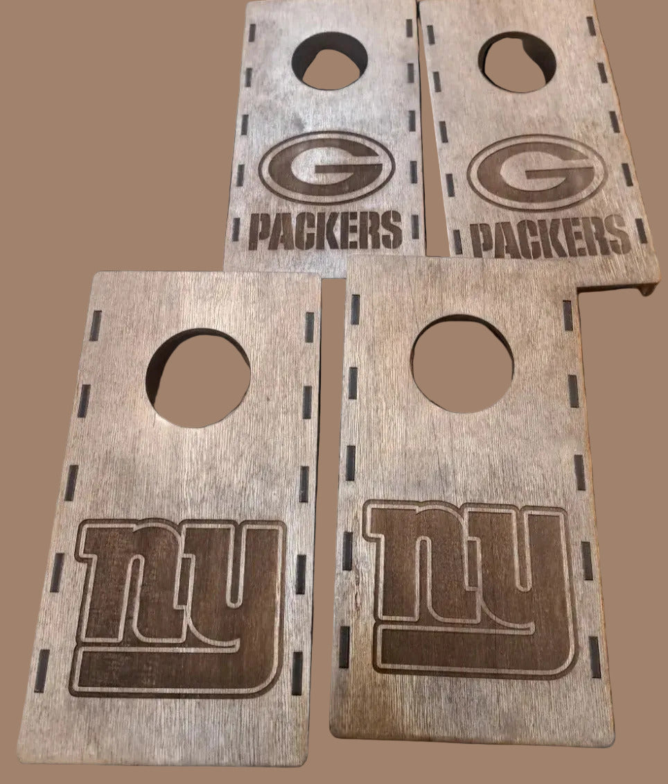 Wooden board with cut-out holes and engraved logos on a wooden surface