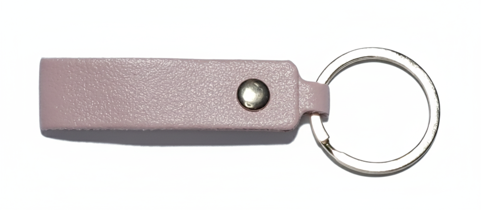 Pink leather keychain with a metal ring pictured on a white background