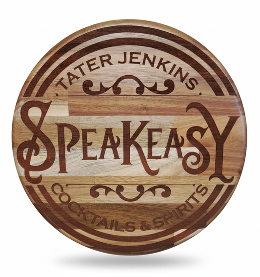 Wooden circular sign with 'Tater Jenkins Speakeasy Cocktails & Spirits' engraved on it.